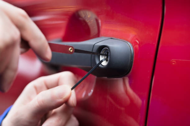 Mobile auto locksmith unlocking a car after keys were locked inside